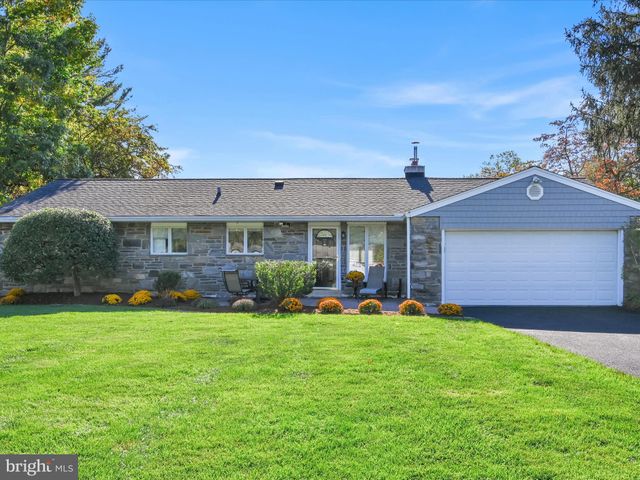 a front view of a house with a yard and porch