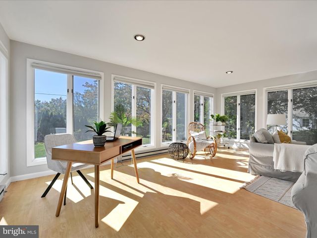 a view of a patio with a dining table and chairs