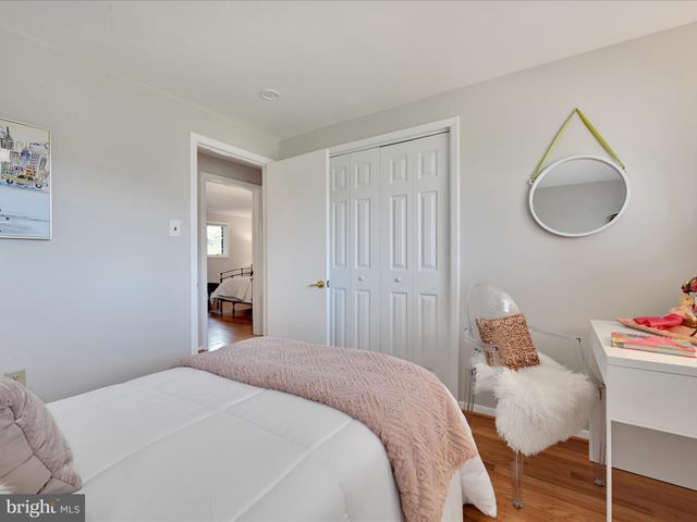 a bedroom with a bed and a chair