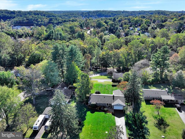 an aerial view of a house with yard