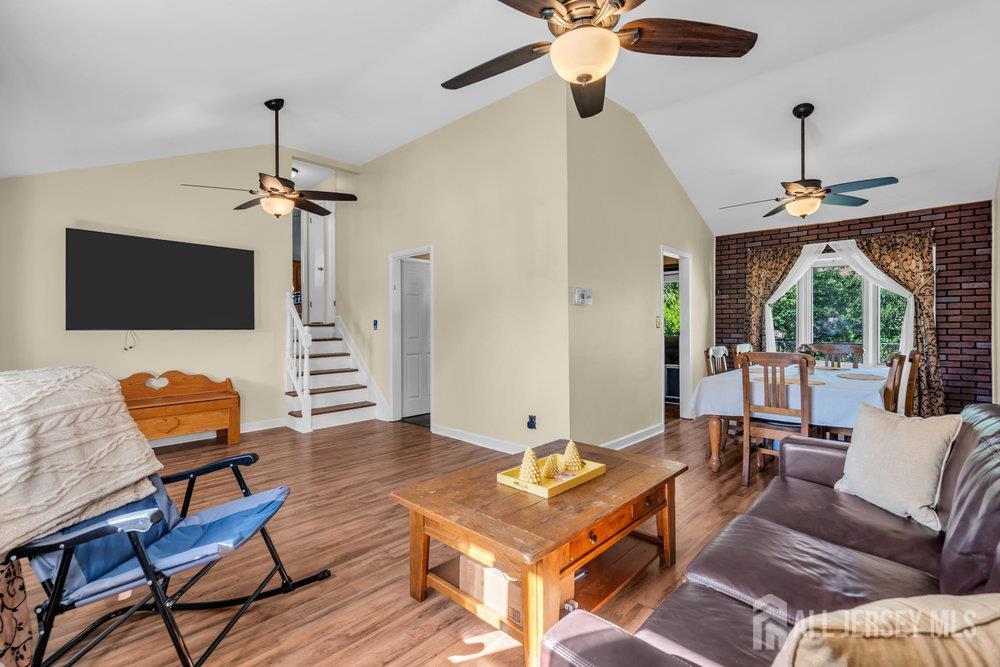 73 Webb Drive Fords, NJ 08863 - Photo 15 of 65 a living room with furniture a ceiling fan and a flat screen tv