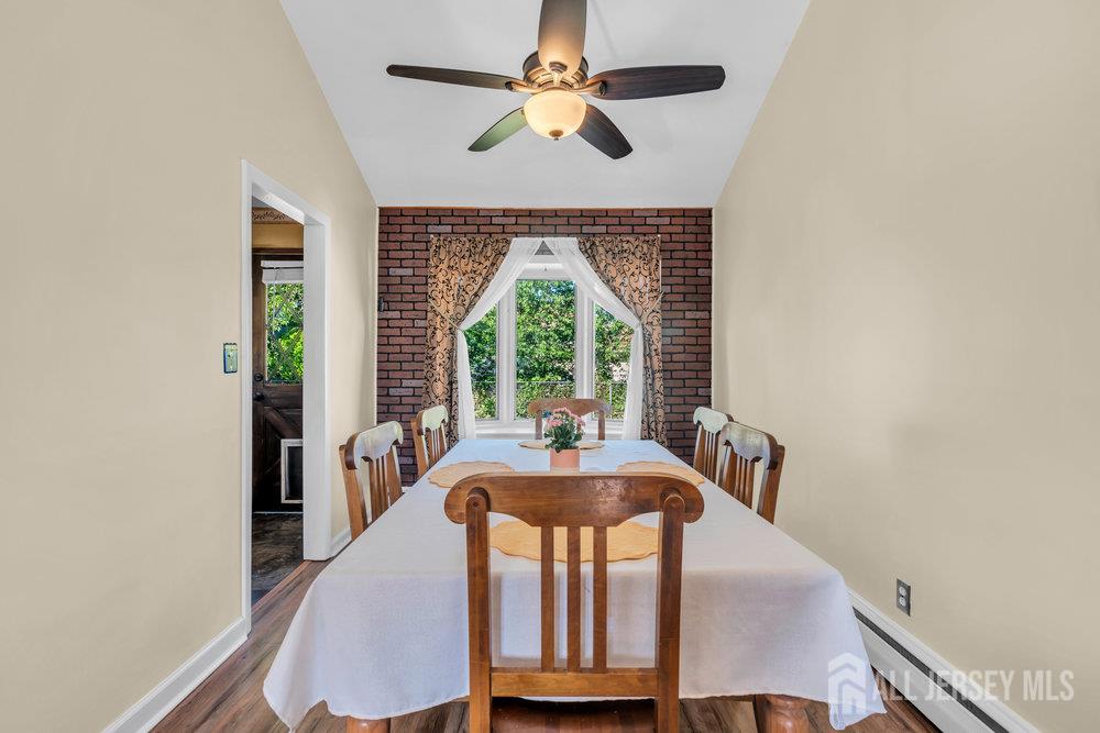 73 Webb Drive Fords, NJ 08863 - Photo 17 of 65 a dining room with furniture a large window and wooden floor