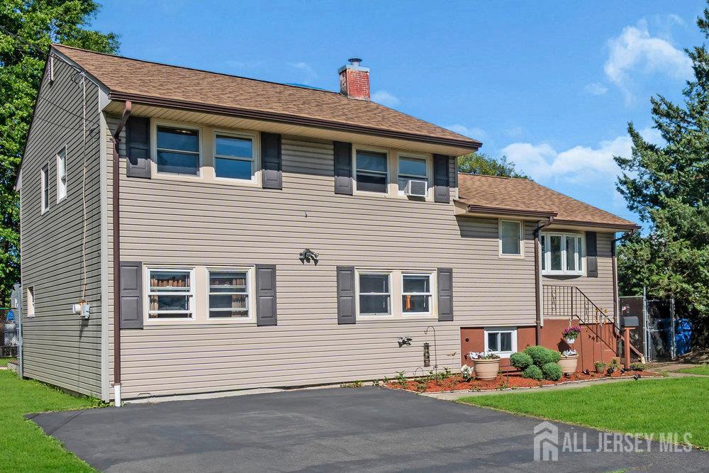 73 Webb Drive Fords, NJ 08863 - Photo 2 of 65 a front view of a house with a yard