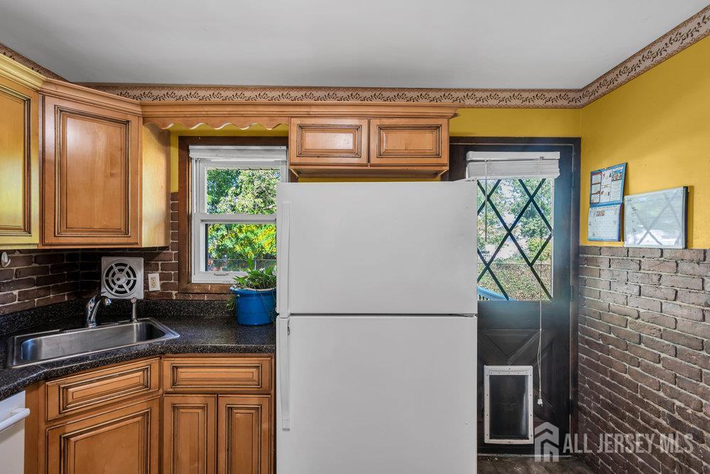 73 Webb Drive Fords, NJ 08863 - Photo 27 of 65 a kitchen with stainless steel appliances a refrigerator and a sink
