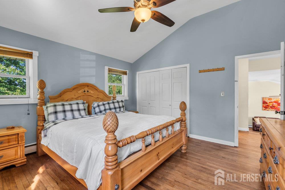 73 Webb Drive Fords, NJ 08863 - Photo 29 of 65 a bed room with a bed and a chandelier