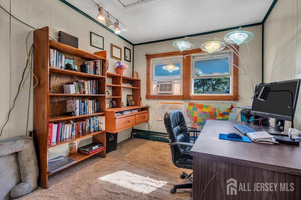 73 Webb Drive Fords, NJ 08863 - Photo 34 of 65 a view of a workspace with furniture and a book shelf