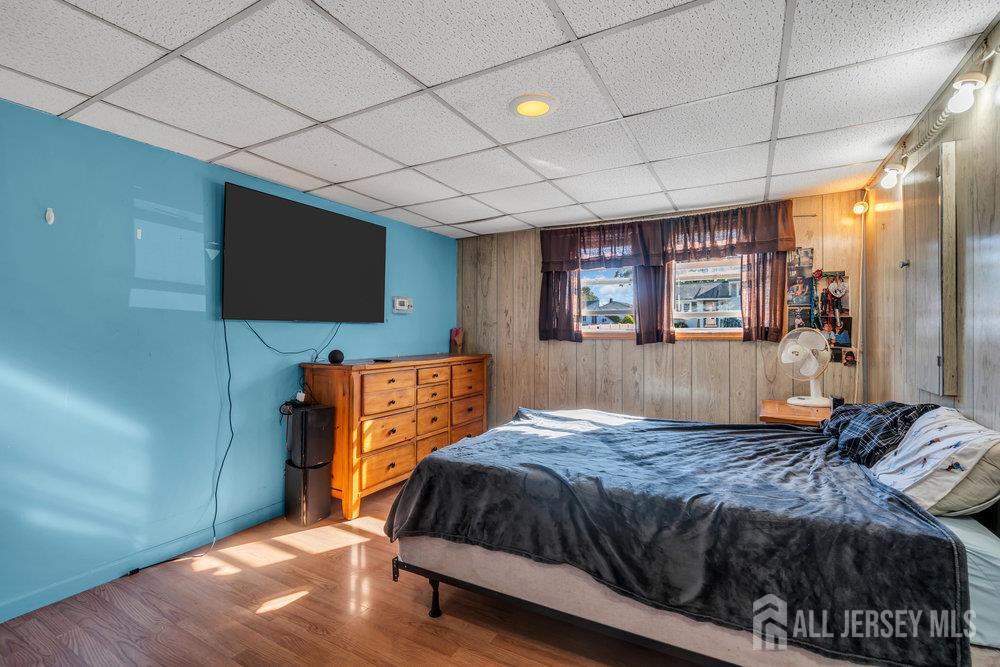 73 Webb Drive Fords, NJ 08863 - Photo 38 of 65 a bedroom with a large bed and a flat tv screen