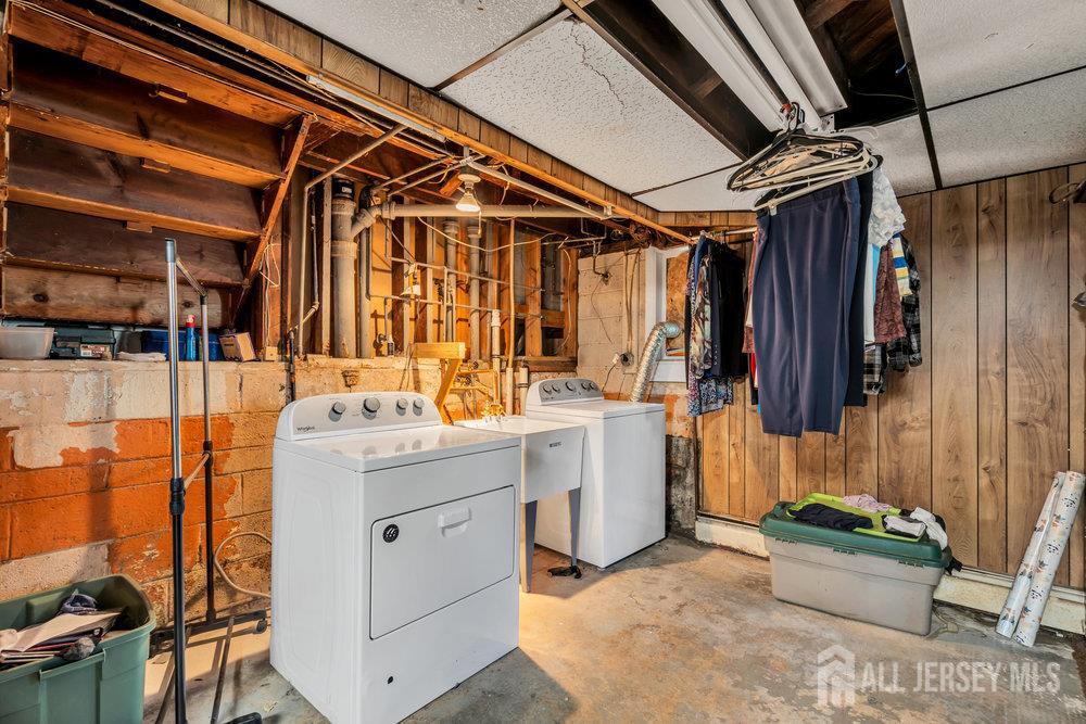 73 Webb Drive Fords, NJ 08863 - Photo 40 of 65 a utility room with dryer and washer