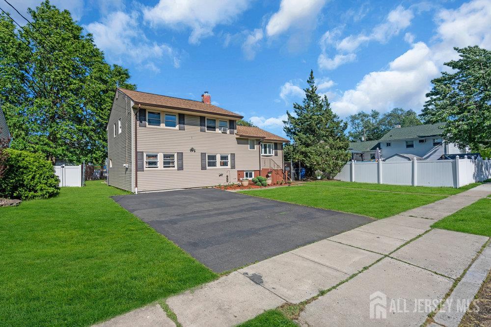 73 Webb Drive Fords, NJ 08863 - Photo 5 of 65 a view of house with a yard