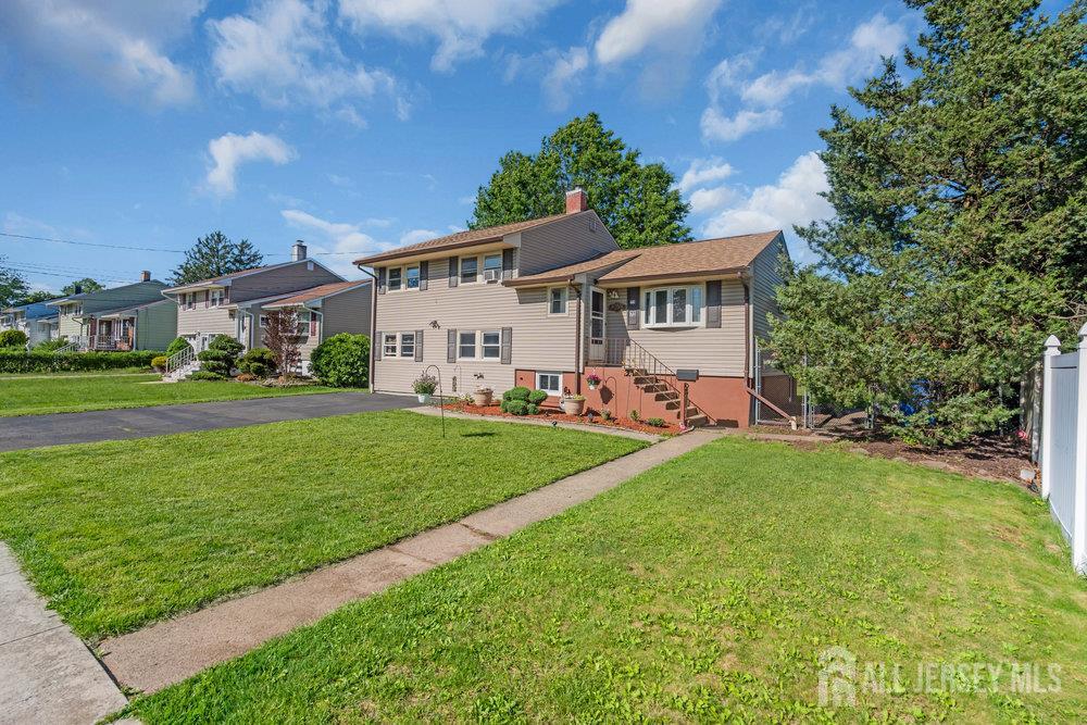 73 Webb Drive Fords, NJ 08863 - Photo 55 of 65 a front view of house with yard and green space