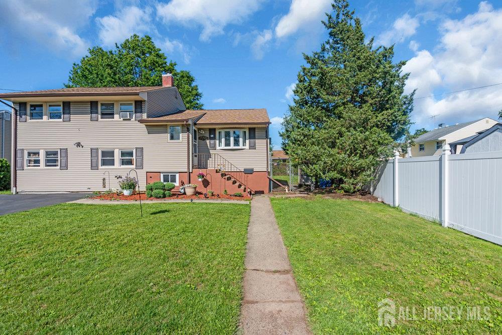 73 Webb Drive Fords, NJ 08863 - Photo 56 of 65 a front view of a house with a yard