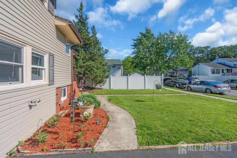 73 Webb Drive Fords, NJ 08863 - Photo 57 of 65 a backyard of a house with table and chairs