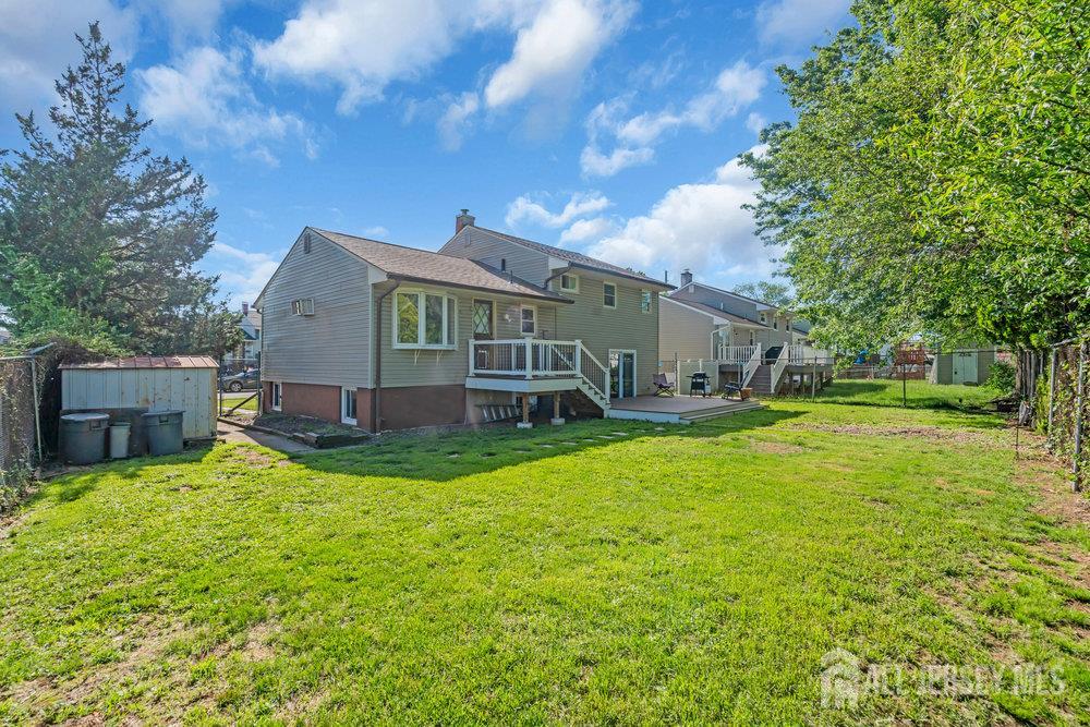 73 Webb Drive Fords, NJ 08863 - Photo 58 of 65 a view of a house with a back yard