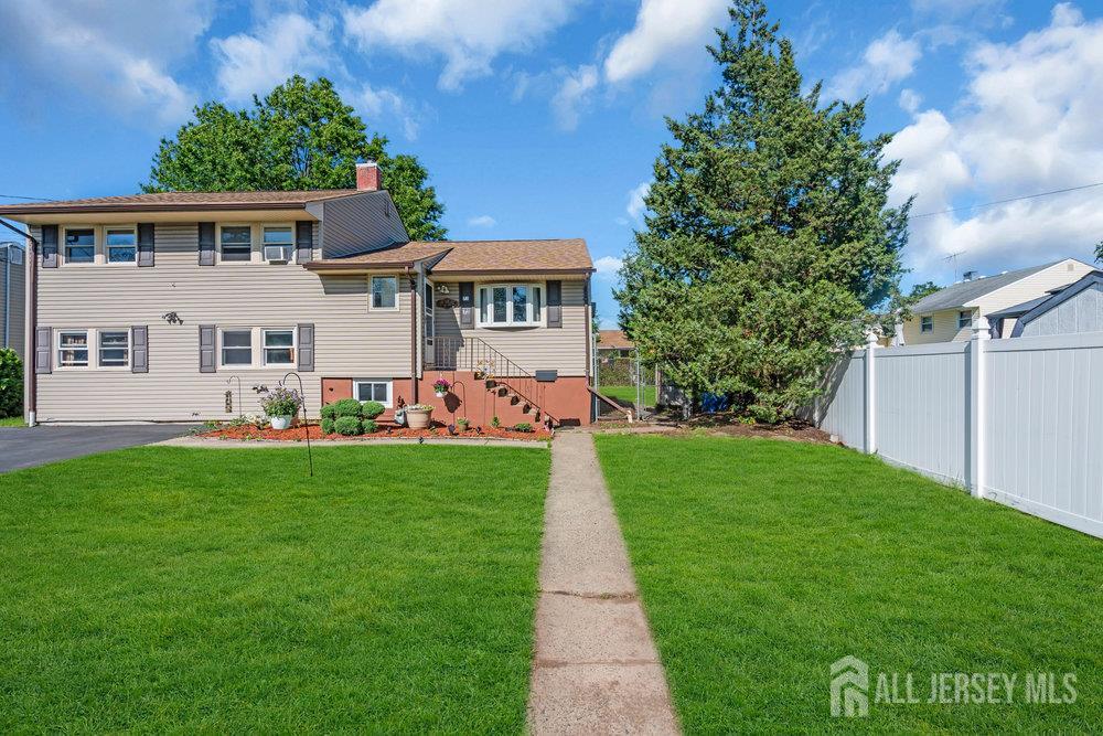 73 Webb Drive Fords, NJ 08863 - Photo 7 of 65 a front view of a house with a yard