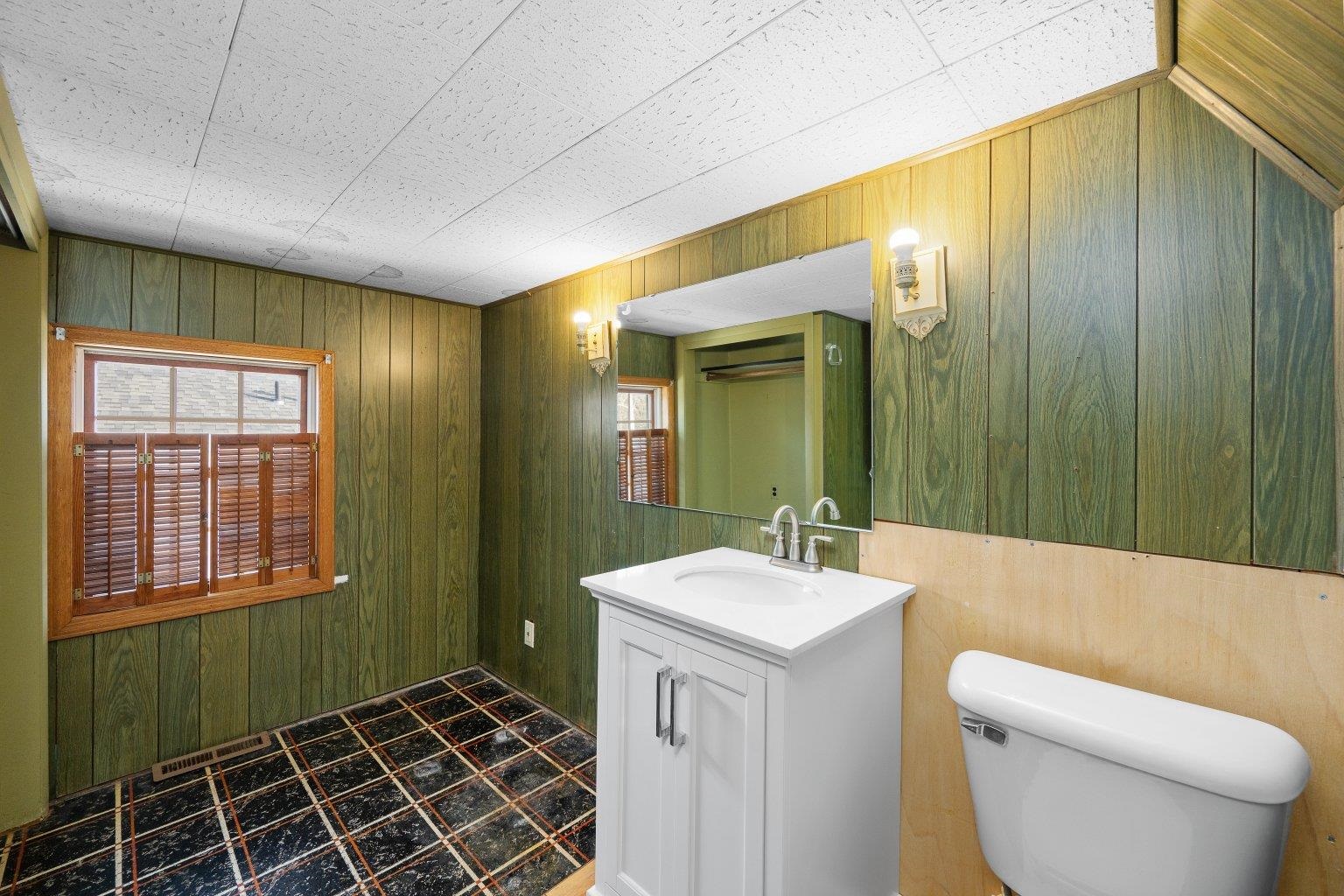 5108 6th Avenue Moline, IL 61265 - Photo 18 of 23 a bathroom with a sink toilet and shower