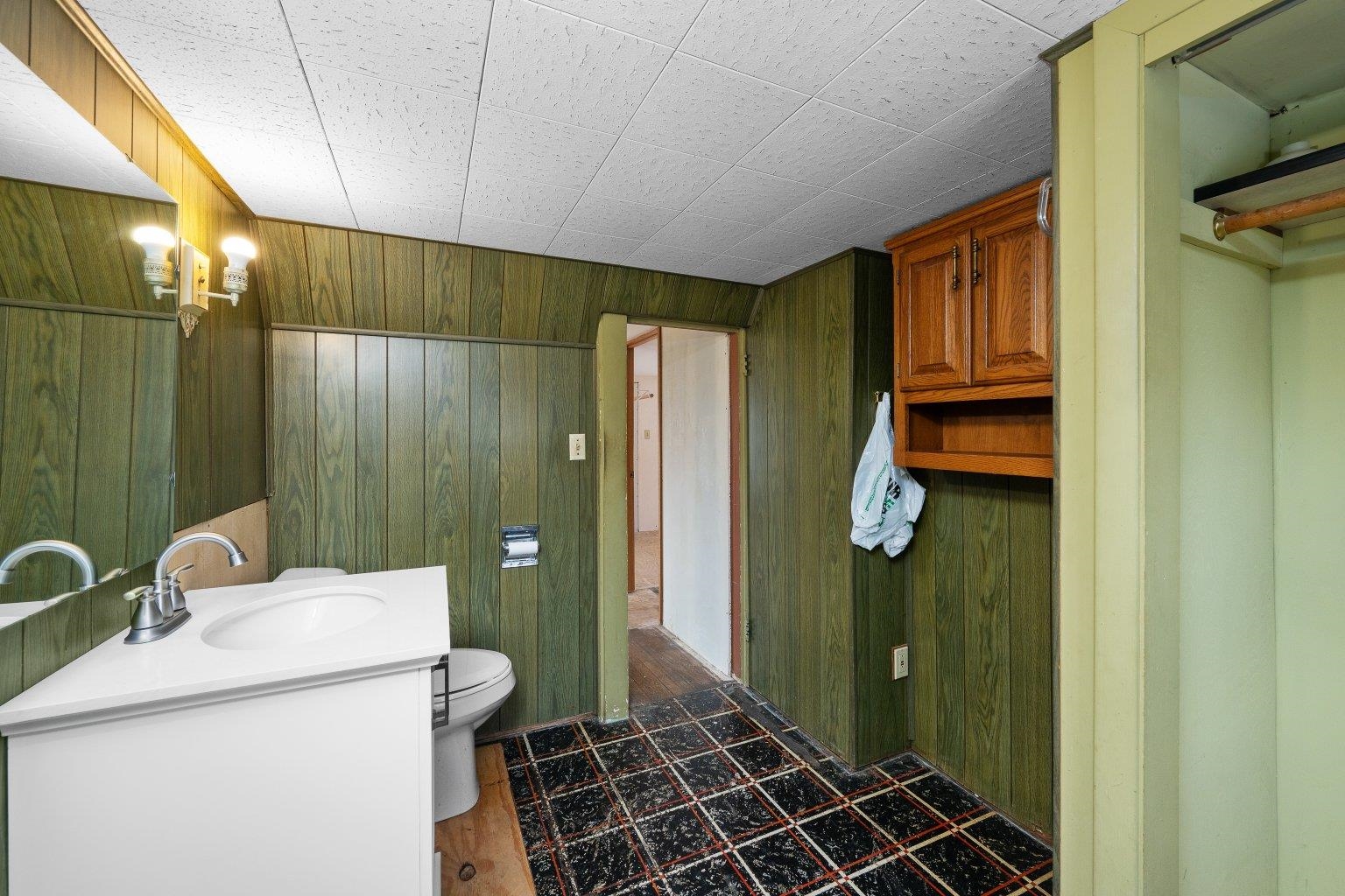 5108 6th Avenue Moline, IL 61265 - Photo 19 of 23 a bathroom with a sink a toilet and shower
