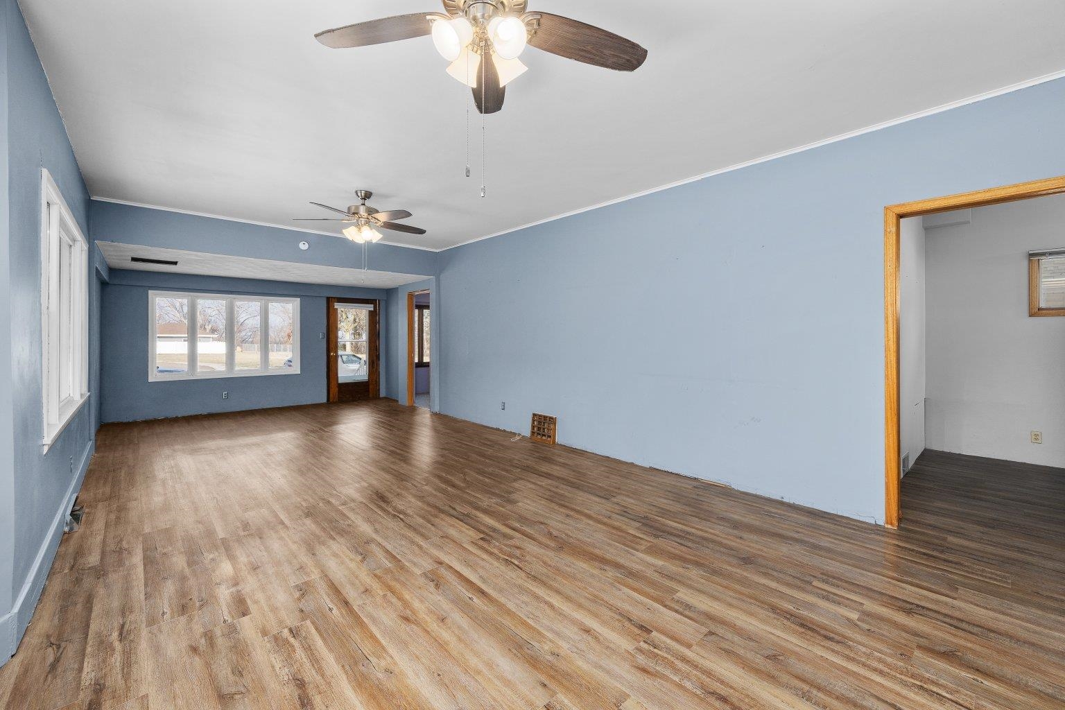 5108 6th Avenue Moline, IL 61265 - Photo 4 of 23 wooden floor in an empty room with a window