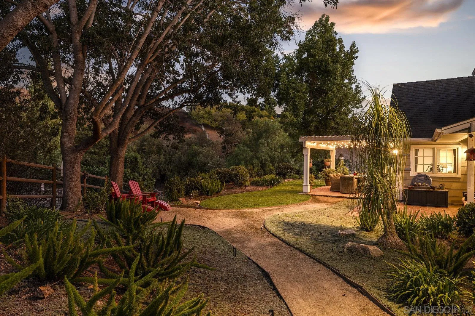 20455 Elfin Forest Road Escondido, CA 92029 - Photo 11 of 50 a view of a backyard with couches under an umbrella