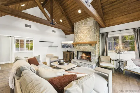 a kitchen with kitchen island granite countertop a center island a sink stainless steel appliances and cabinets