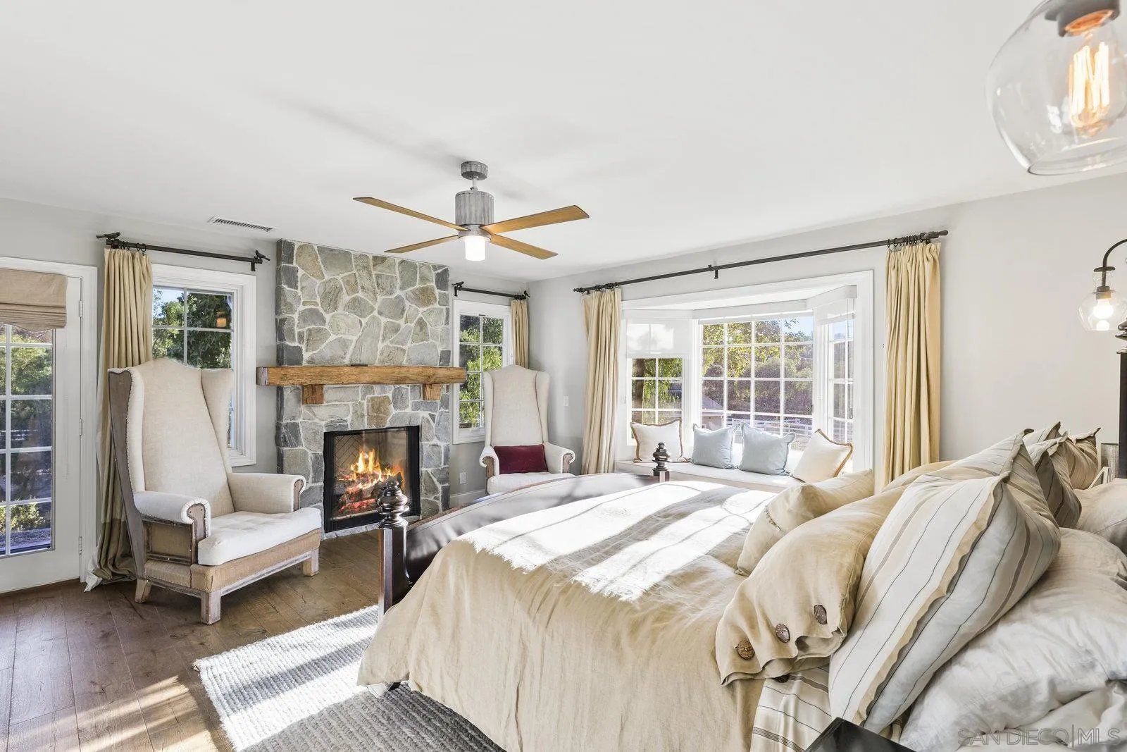 20455 Elfin Forest Road Escondido, CA 92029 - Photo 20 of 50 a bedroom with a bed and a fireplace