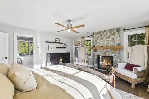 a spacious bathroom with a granite countertop sink and a mirror