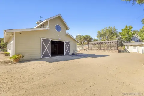 a living room with gym equipment and a mirror