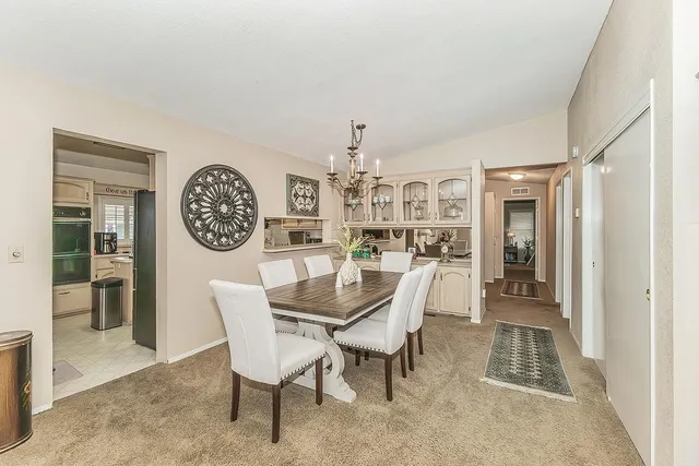 a dining room with furniture and window