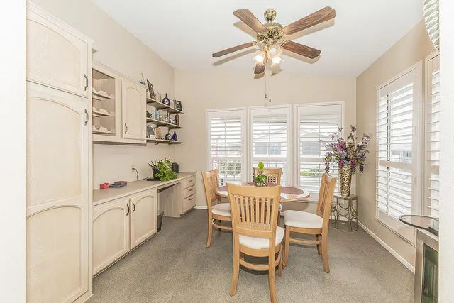 a view of a dining room with furniture window and outside view