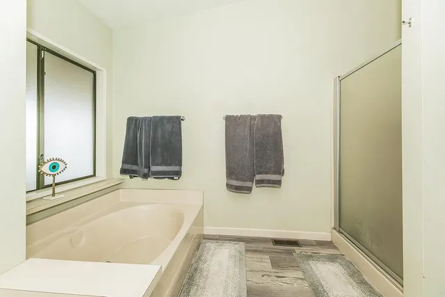 a bathroom with a toilet a sink a vanity and mirror