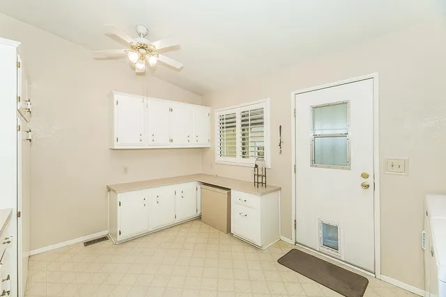 a view of cabinets and wooden floor