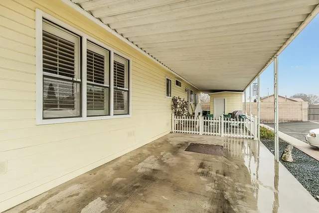 a balcony with table and chairs