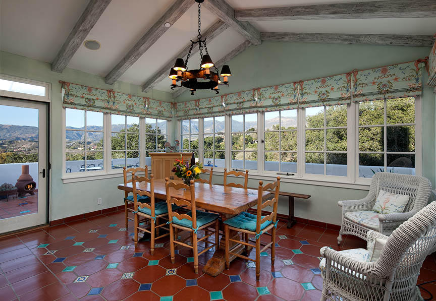 695 Via Hierba Santa Barbara, CA 93110 - Photo 12 of 29 a dining room with furniture a chandelier and wooden floor