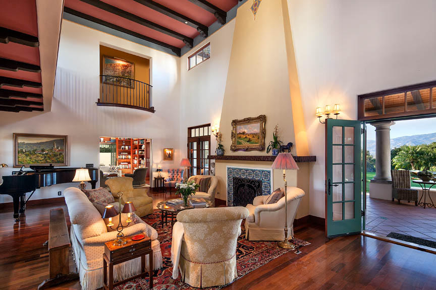 695 Via Hierba Santa Barbara, CA 93110 - Photo 5 of 29 a living room with furniture a fireplace and wooden floor