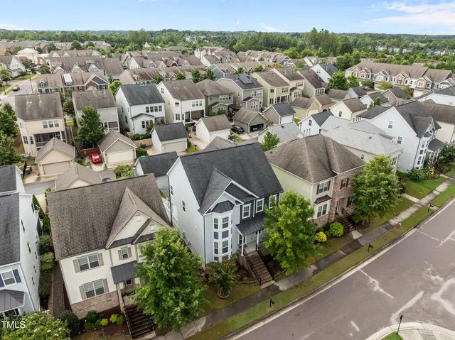 an aerial view of residential houses with outdoor space