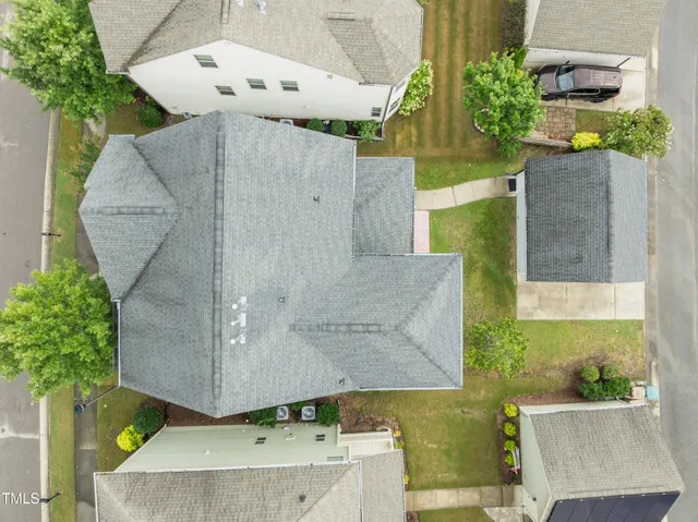 an aerial view of a house with a swimming pool