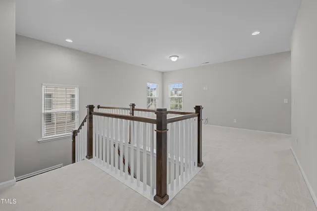 a view of a hallway with stairs