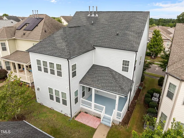a aerial view of a house with a yard