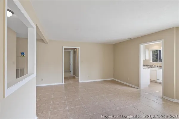 a kitchen with a sink a stove a refrigerator and cabinets