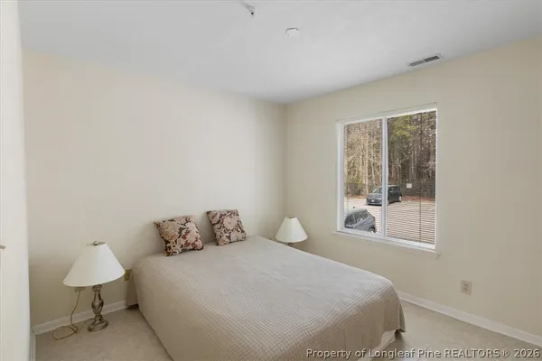 a bathroom with a toilet and a bathtub