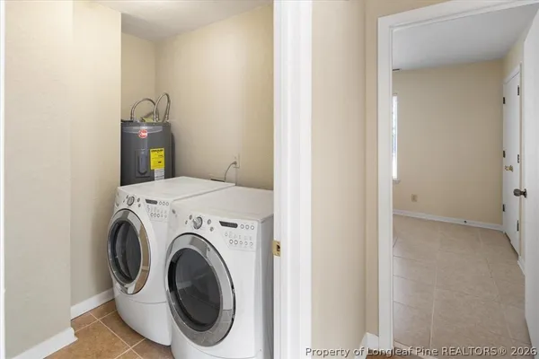 a bathroom with a sink a mirror a toilet and a bathtub
