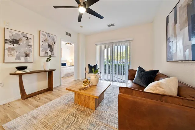 a living room with furniture and a window