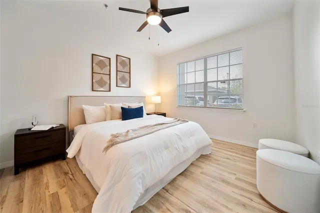 a bedroom with a bed and a couch