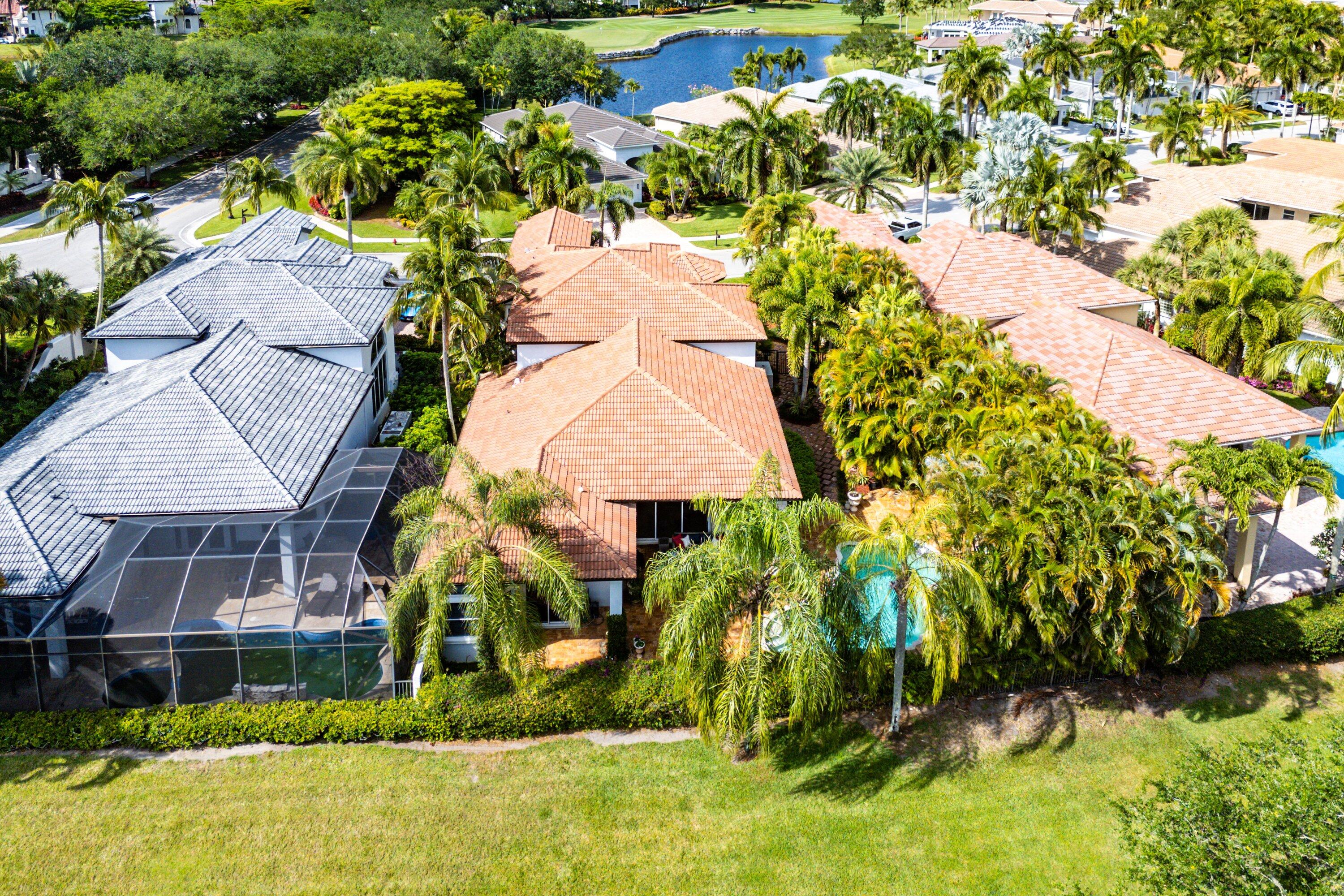 16312 Braeburn Ridge Trail Delray Beach, FL 33446 - Photo 7 of 12 an aerial view of a house with a yard and large tree