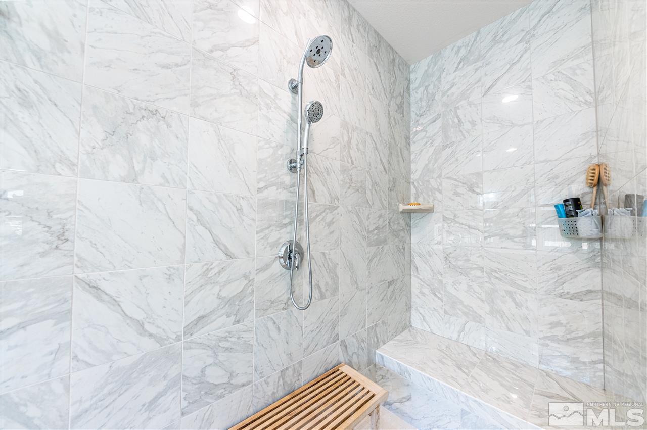 9845 Shadowless Trail Reno, NV 89521 - Photo 19 of 40 a bathroom with a shower