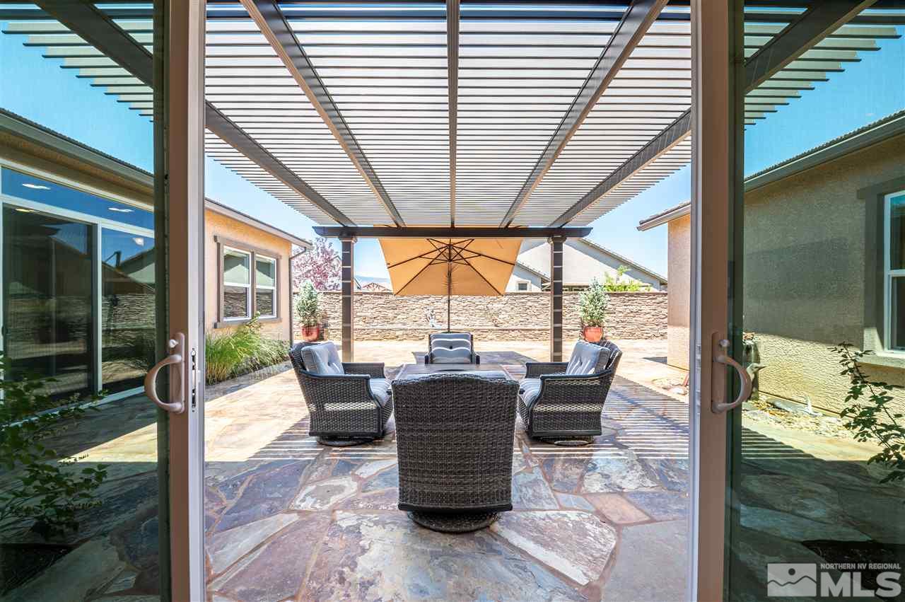 9845 Shadowless Trail Reno, NV 89521 - Photo 23 of 40 a dining room with furniture and garden view