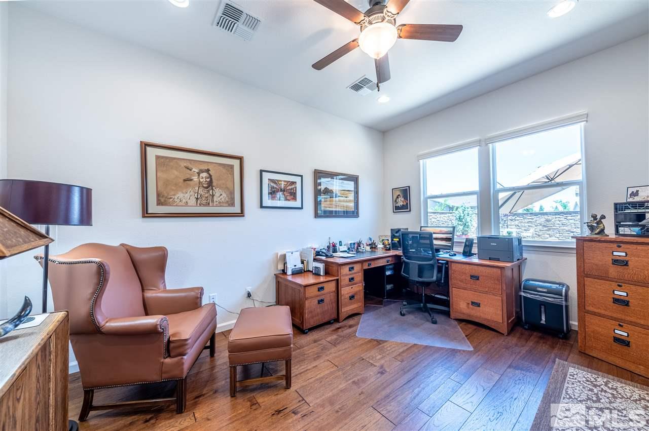 9845 Shadowless Trail Reno, NV 89521 - Photo 27 of 40 a room with furniture and windows