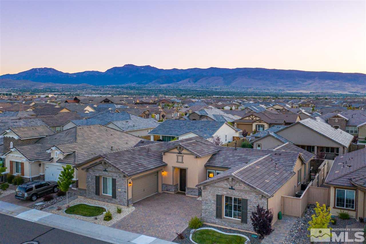 9845 Shadowless Trail Reno, NV 89521 - Photo 34 of 40 an aerial view of multiple houses with a mountain