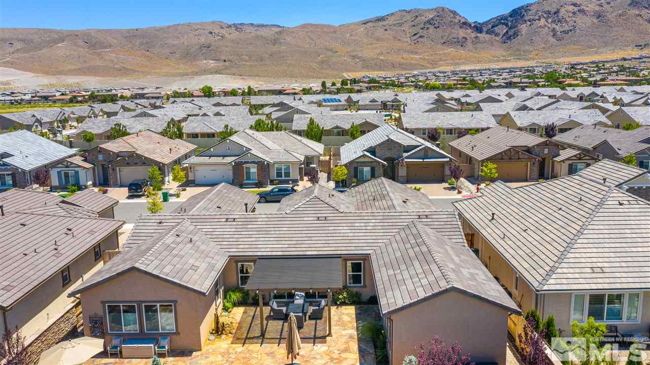 9845 Shadowless Trail Reno, NV 89521 - Photo 36 of 40 an aerial view of a residential apartment building with a mountain