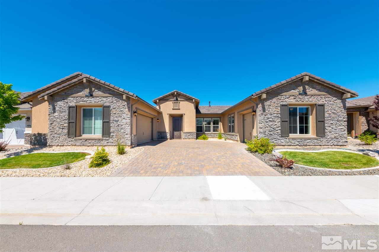 9845 Shadowless Trail Reno, NV 89521 - Photo 5 of 40 a front view of a house with a yard