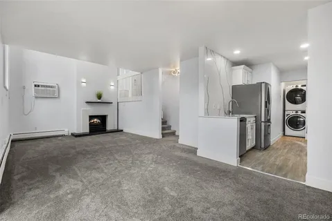 a view of kitchen and refrigerator